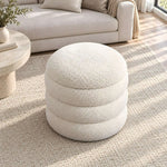 Close-up of Flukinora Cream Pouf With Storage, highlighting circular padded top and a fully upholstered silhouette & storage.