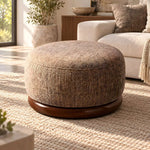 Hekolina Brown Round Ottoman product view showing rounded upholstered body and woven-look texture in a modern home setting.