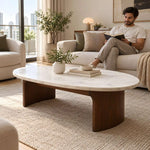Alternate view of Isshomina White Marble Coffee Table, showing rounded oval top, smooth curved edges, and panel-style legs.