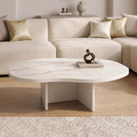 Cloud Curve Solid Surface Gold Coffee Table with smooth white curved surface and subtle gold veining, supported by a minimalist cross base, styled in a modern living room setting.