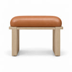 Caramel tan leather covers the padded top of the Vendisora Pedicure Footrest, paired with a narrow wood front rail.