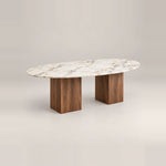 Arvizta Marble Top 6-Seater Dining Table on a neutral studio floor, showing an oval marble top alongside warm wood grain.