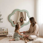 Alternate angle of Capzie Cloud Kids Mirror, showing smooth rounded design for a modern children's bedroom interior.