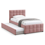 Cemaliso Dusty Pink Kids Trundle Bed: dusty pink upholstery, square padded panels and white bedding against a white backdrop.