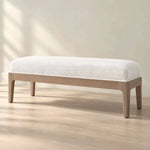 Chelsaria Cream Upholstered Wooden Bench featuring rounded edges in a clear product photograph in a modern home setting.