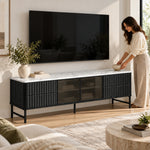 Chestiko White Marble Top TV Unit with a woman beside the living room media wall, featuring straight cabinet edges.
