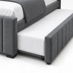 Chikilora Dark Grey Kids Trundle Bed detail showing vertical channels on the pull-out front, small wheels and white bedding.
