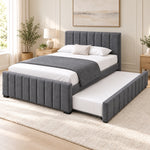 Chikilora Dark Grey Kids Trundle Bed in a furnished bedroom, featuring a channelled footboard and dark grey upholstery.