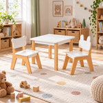 Costzony White Kids Table with 2 Chairs displays a bear-ear chair together with a bunny-ear chair beside a playroom window.