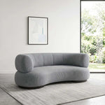 Close-up of Curlina Grey Curved Modern 3-Seater Sofa, highlighting curved silhouette for a modern living room interior.