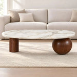 Daslovita Marble Coffee Table product photo showing oval top and sculptural mixed supports in a clean studio setting.