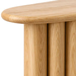 Derveno Wooden Console Table product view showing rounded-edge tabletop and four-pillar base in a balanced home interior.