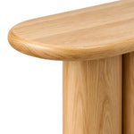 Close-up of Derveno Wooden Console Table, highlighting rounded-edge tabletop and four-pillar base in a modern home setting.