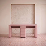 Esmiro Pink Manicure Table with Storage product photo showing spacious worktop and open shelving in a clean studio setting.