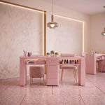 Further product view of Esmiro Pink Manicure Table with Storage, featuring integrated storage for a modern salon interior.