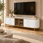 Furnilosa White Marble Top TV Unit pairs gold-framed glass doors with rounded fluted ends beside living room seating.