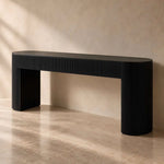 Hamiltola Black Console Table featuring fluted vertical detailing and curved tabletop profile in a clear product photograph.