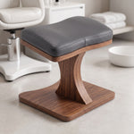 Hangari Grey Pedicure Footrest featuring contoured padded surface and sturdy wooden base in a clear product photograph.