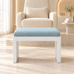 Harteslo Pedicure Footrest featuring straight end supports alongside a rounded padded top before a cream salon chair.