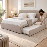 Hensylona Taupe Kids Trundle Bed, white quilted bedding and taupe upholstery, with bedding being arranged on the trundle.