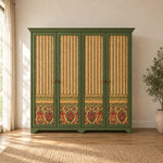 Herylosara Green 4 Door Cabinet shown with a shaped cornice, floral lower panels and green framing in a sunlit bedroom.