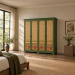 Herylosara Green 4 Door Cabinet against a bedroom wall: floral lower panels, a shaped cornice and four decorative doors.