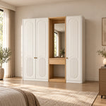 Kapilosa 3 Door Wardrobe with Dressing Mirror, showing white arch-panel doors and small brass-tone pulls in a sunlit bedroom.