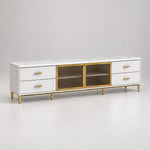 Kavonsa White Marble Top TV Unit: slender gold-tone legs, a white marble top and four side drawers against a grey backdrop.