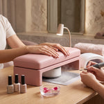 Another product view of Lynela Pink Manicure Hand Rest, highlighting sturdy base in a clean, contemporary salon setting.