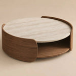 Miromona Travertine Round Coffee Table product photo showing round top and curved wood frame in a clean studio setting.