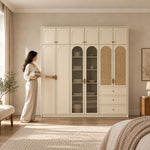 Mossylora Wardrobe with Storage Cabinet with a woman standing beside the cabinet; three lower drawers and upper cupboards.