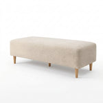 Munchikora Beige Upholstered Bench featuring fully upholstered body and soft cushioned seating in a clear product photograph.