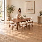Close-up of Nysoliny Wooden Oval 6-Seater Dining Table, highlighting oval tabletop with a slim edge in a modern home setting.