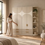 Penekito 4 Door Wardrobe with Drawers with a woman standing beside the cabinet, featuring vertical brass-tone handles.