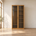 Porteriy 2 Door Wooden Closet Cabinet in a furnished bedroom, showing long slim pulls alongside visible interior shelves.