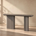 Pulanira Wooden Console Table product photo showing rounded tabletop and twin pedestal legs in a clean studio setting.