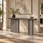 Close-up of Pulanira Wooden Console Table, highlighting rounded tabletop and twin pedestal legs in a modern home setting.
