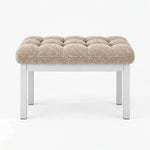 Rebosy Pedicure Footrest brings together four straight metal legs and deep button detailing against a white backdrop.