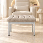 Rebosy Pedicure Footrest shown with deep button detailing, a slim front rail and rounded padded edges in a softly lit salon.