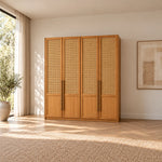 Segustona 4 Door Wooden Wardrobe featuring long vertical pulls alongside separate lower door panels in a sunlit bedroom.