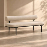 Sillopura Beige Upholstered Modern Bench featuring padded seat and cylindrical backrest in a clear product photograph.