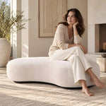 Sinolora Cream Upholstered Accent Bench product view showing rounded silhouette, plush upholstery, and curved edges.