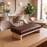 Siyara Brown Manicure Hand Rest featuring comfortable cushioned surface and sturdy wooden legs in a clear product photograph.