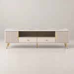 Vendrilosa White Marble Top TV Unit brings together angled gold-tone legs and two lower drawers against a grey backdrop.