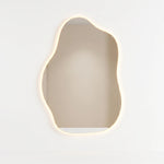 Alternate view of Walnutty Salon Mirror, showing organic curved shape and wall-mounted mirror for a modern salon interior.