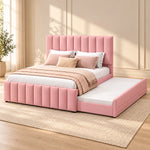 Werlisori Pink Kids Trundle Bed against a bedroom wall, showing wide padded channels alongside an extended side trundle.