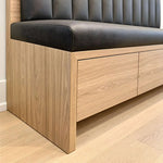 Close-up of Zenoly Grey Storage Bench, highlighting channel-tufted backrest and padded seat in a balanced home interior.