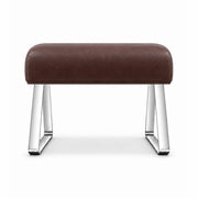Anoltina Pedicure Footrest in brown leather with a thick curved cushion and polished metal legs forming angled sled supports.