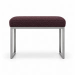 Bencivola Pedicure Footrest with deep plum brown fabric upholstery and stitched cushion edges, shown against white.