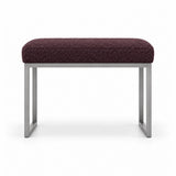 Bencivola Pedicure Footrest with deep plum brown fabric upholstery and stitched cushion edges, shown against white.
